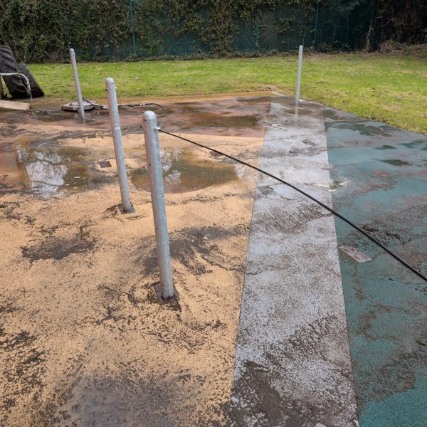 Commercial play area surface before cleaning - mud and algae build-up