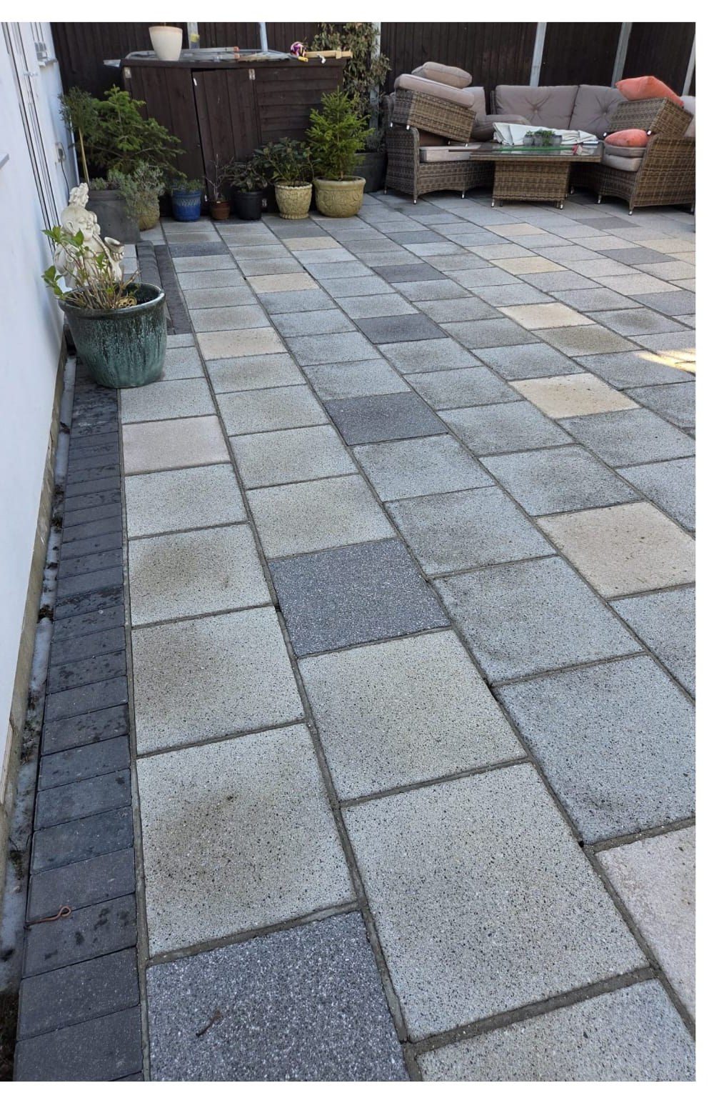 Garden patio after pressure washing - original colour restored